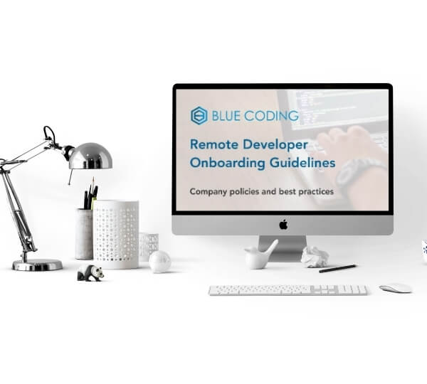 White computer screen and desk with a lamp showing blue coding's onboarding guide